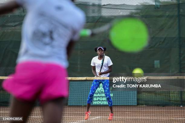 Kenyan tennis prodigy, Angella Okutoyi is pictured during a training session in Nairobi on April 26, 2022. - Angela Okutoyi became the first Kenyan...