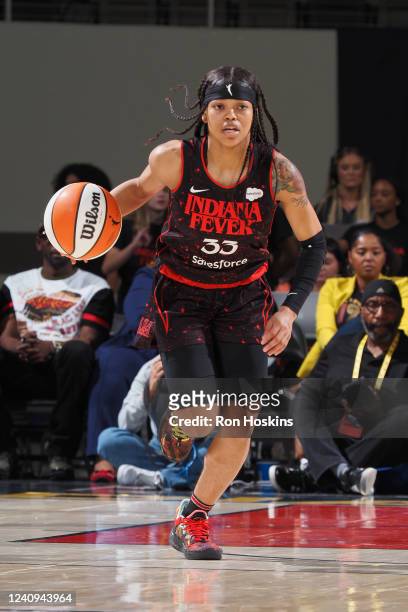 Destanni Henderson of the Indiana Fever dribbles the ball during the game against the Los Angeles Sparks on May 27, 2022 at Indiana Famers Coliseum,...