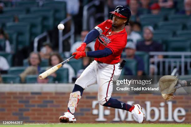 Ozzie Albies of the Atlanta Braves hits a two RBI double during the seventh inning against the Miami Marlins at Truist Park on May 27, 2022 in...