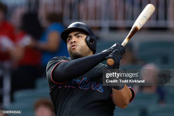 Jesus Aguilar of the Miami Marlins reacts as he hits a two run home run during the sixth inning against the Atlanta Braves at Truist Park on May 27,...