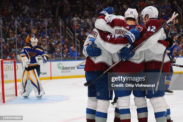 Compher of the Colorado Avalanche celebrates with teammates on the ice after Compher scored a goal against the St. Louis Blues in the second period...
