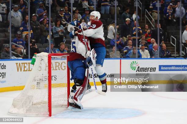 Nathan MacKinnon of the Colorado Avalanche celebrates with goaltender Darcy Kuemper after the Avalanche won Game six to clinch the Second Round of...