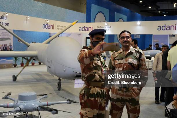 Indian Army officers take a selfie photograph at the Adani Defence and Aerospace stall at the Drone Festival - Bharat Drone Mahotsav 2022, at Pragati...
