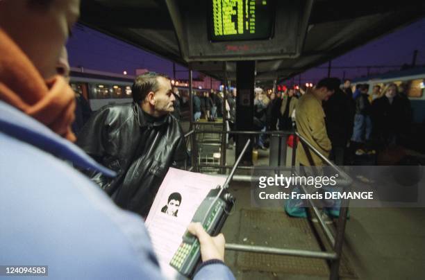 Murders in French trains: An SNCF agent Holding Portrait of suspect Sid Ahmed Rezala In Dijon, France On December 16, 1999.