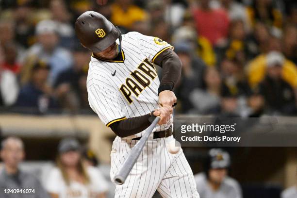 Wil Myers of the San Diego Padres hits an RBI single during the eighth inning of a baseball game against the Pittsburgh Pirates on May 27, 2022 at...