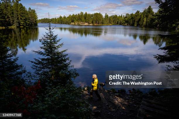 Becky Rom, an Ely native and environmental activist, stands on the bank of Hegman Lake, part of the Boundary Waters Canoe Area Wilderness, on...