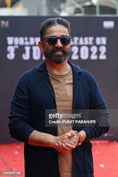 Bollywood actor Kamal Haasan poses for pictures as he arrives to promote his new film Vikram in Mumbai on May 28, 2022.