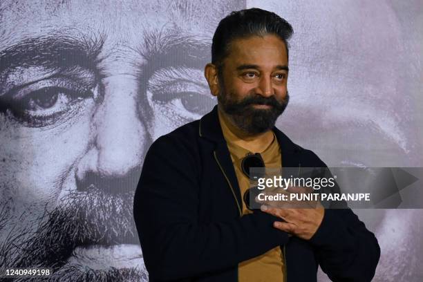 Bollywood actor Kamal Haasan gestures during a news conference to promote his new film Vikram in Mumbai on May 28, 2022.