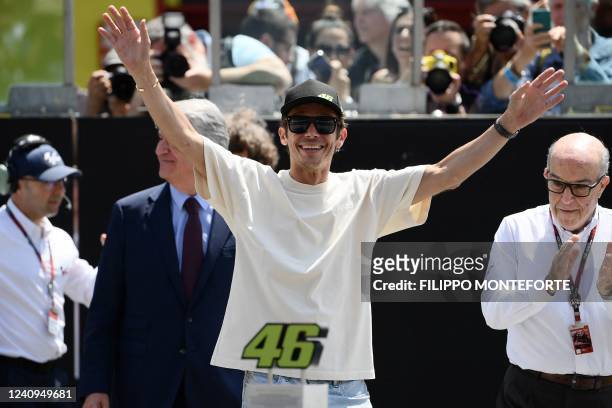 Nine time World Champion, Italy's Valentino Rossi waves during a retirement ceremony of his iconic number 46, ahead the Italian Moto GP Grand Prix at...