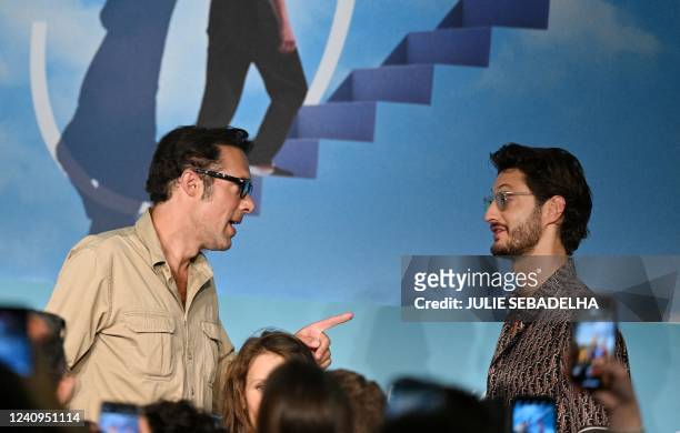 French film director Nicolas Bedos and French actor Pierre Niney arrive to attend a press conference for the film "Mascarade" during the 75th edition...