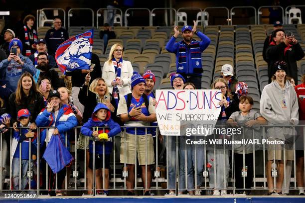 Bulldogs fans celebrate the teams win during the 2022 AFL Round 11 match between the West Coast Eagles and the Western Bulldogs at Optus Stadium on...