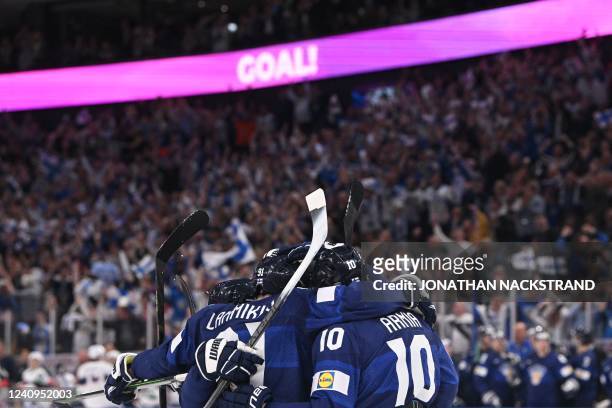Finland's team celebrates the 3-2 during the IIHF Ice Hockey World Championships half final match between Finland and USA in Tampere, Finland, on May...