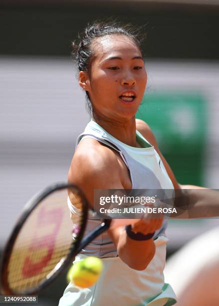 China's Zheng Qinwen returns the ball to France's Alize Cornet during their women's singles match on day seven of the Roland-Garros Open tennis...