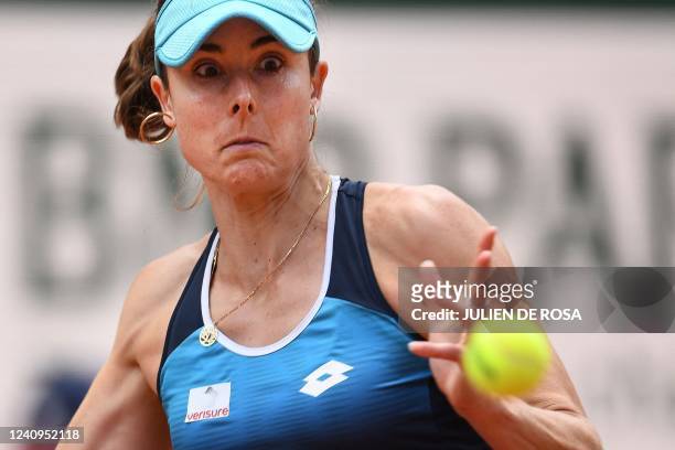France's Alize Cornet reacts as she plays against to China's Zheng Qinwen during their women's singles match on day seven of the Roland-Garros Open...