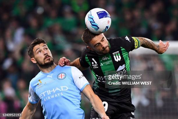 Melbourne City's Mathew Leckie tackles Weatern United's Joshua Risdon during the A-League football grand final between Melbourne City and Western...
