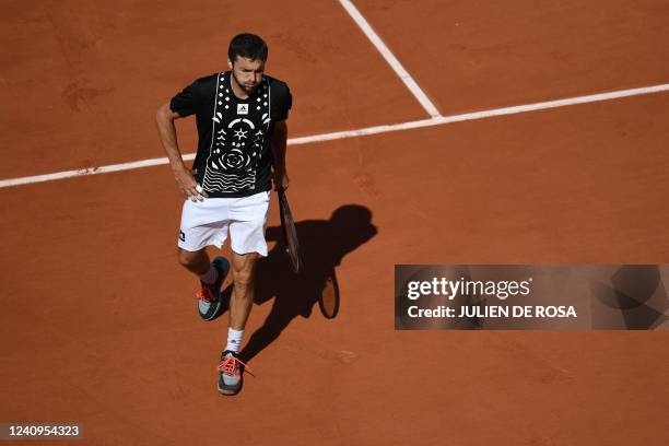 France's Gilles Simon reacts as he plays against Croatia's Marin Cilic during their men's singles match on day seven of the Roland-Garros Open tennis...