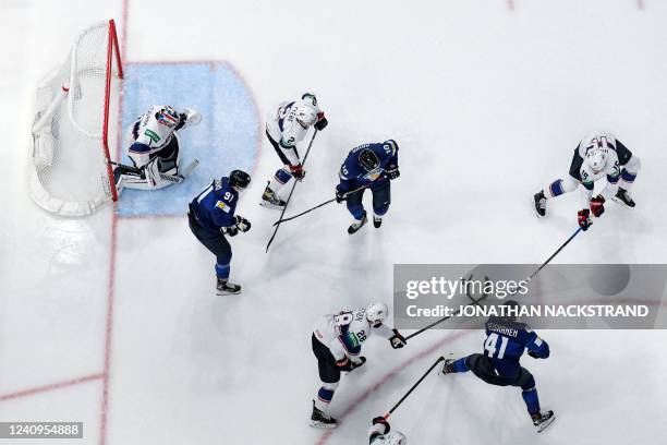 Finland's defender Miro Heiskanen shoots to score past USA's goalkeeper Jeremy Swayman during the IIHF Ice Hockey World Championships half final...