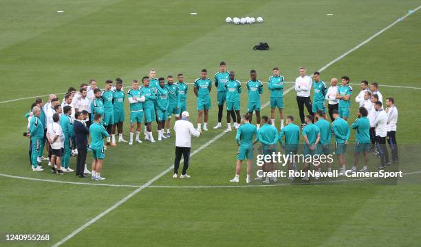 Real Madrid manager Carlo Ancelotti talks to his players prior to training during the Real Madrid Training Session And Press Conference at Stade de...