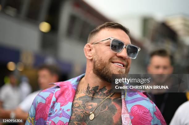 Fighter Conor McGregor walks in the pit area after the qualifying session at the Monaco street circuit in Monaco, ahead of the Monaco Formula 1 Grand...