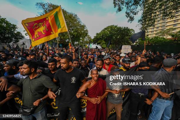 Demonstrators shout slogans during a protest on the 50th day of anti-government protests demanding the resignation of Sri Lanka's President Gotabaya...