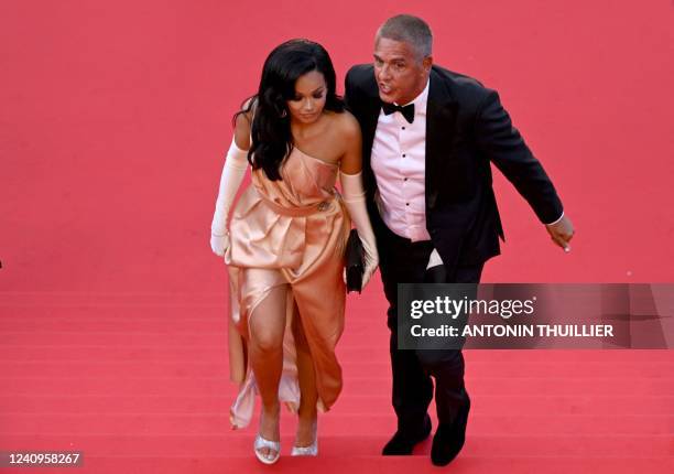 French actor Samy Naceri and his partner Athena arrive for the Closing Ceremony of the 75th edition of the Cannes Film Festival in Cannes, southern...