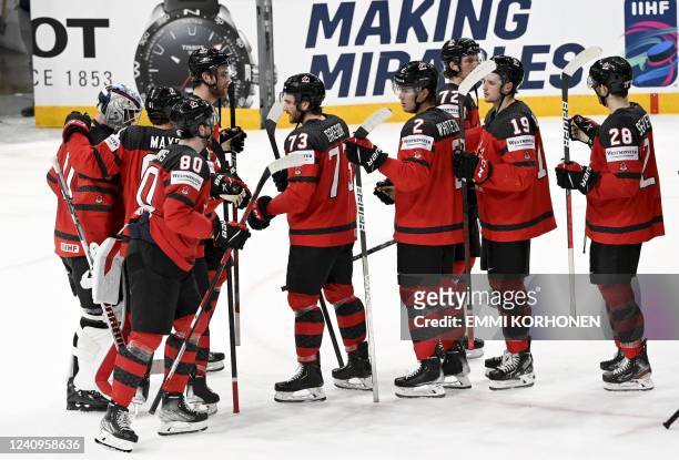 Team Canada celebrates after winning the IIHF Ice Hockey World Championships half final match between Canada and Czech Republic in Tampere, Finland,...