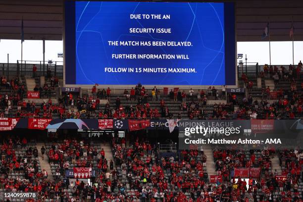 The LED screen announces a delayed kick off due to a security issue before the UEFA Champions League final match between Liverpool FC and Real Madrid...