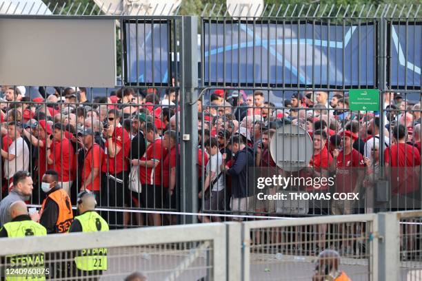 Liverpool fans stand outside unable to get in in time leading to the match being delayed prior to the UEFA Champions League final football match...