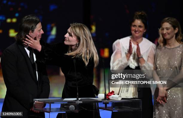 Belgian director Charlotte Vandermeersch kisses Belgian film director Felix Van Groeningen on stage after they were awarded with the Jury Prize for...