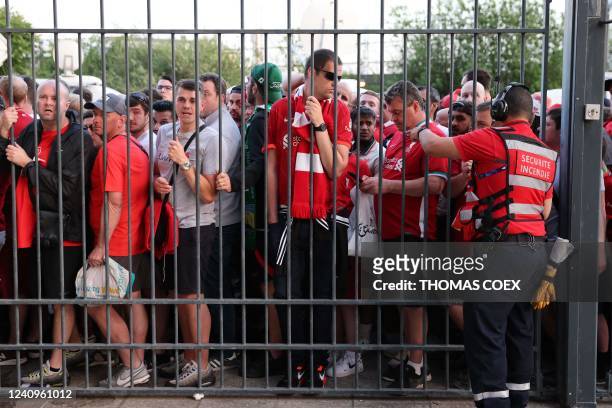 Liverpool fans stand outside unable to get in in time leading to the match being delayed prior to the UEFA Champions League final football match...