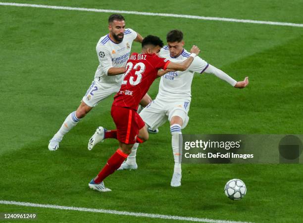 Dani Carvajal of Real Madrid, Luis Diaz of Liverpool FC and Federico Valverde of Real Madrid battle for the ball during the UEFA Champions League...