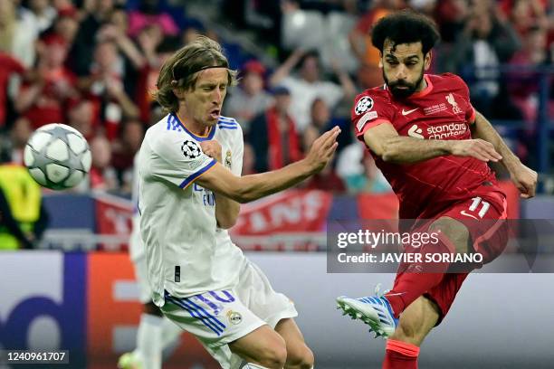 Liverpool's Egyptian midfielder Mohamed Salah and Real Madrid's Croatian midfielder Luka Modric vie during the UEFA Champions League final football...