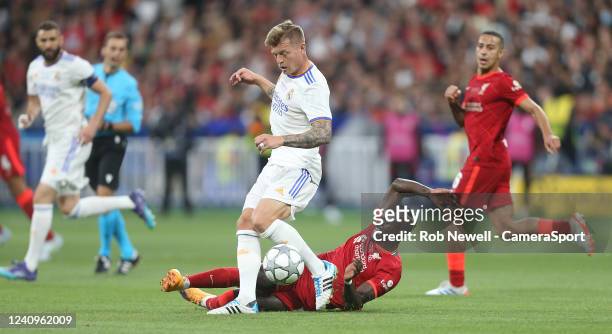 Real Madrid's Toni Kroos is tackled by Liverpool's Sadio Mane during the UEFA Champions League final match between Liverpool FC and Real Madrid at...