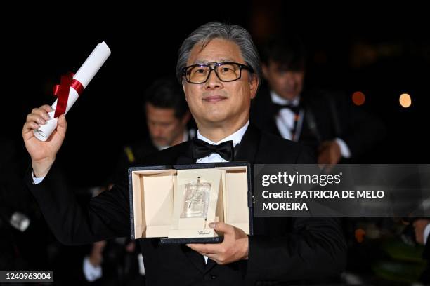 South Korean director Park Chan-Wook poses during a photocall after he won the Best Director prize for the film "Decision to Leave " during the...