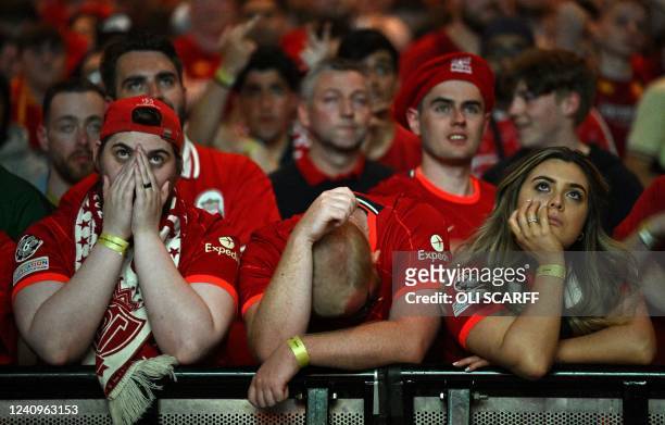 Liverpool supporters in the M&S Bank Arena in Liverpool react as they watch the UEFA Champions League final football match between Liverpool and Real...