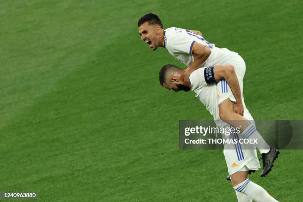 Real Madrid's French forward Karim Benzema and Real Madrid's Spanish midfielder Dani Ceballos celebrate after the UEFA Champions League final...