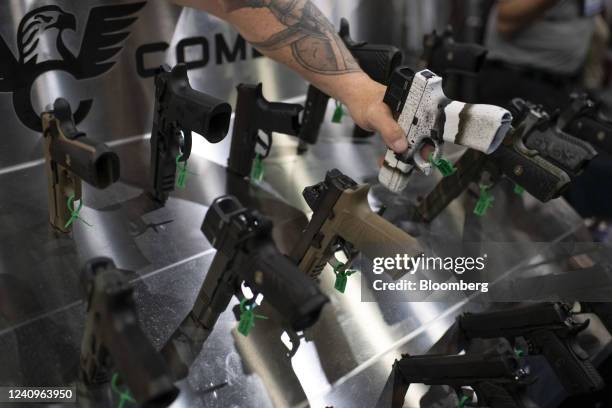 Pistols at the Wilson Combat booth during the National Rifle Association annual convention in Houston, Texas, US, on Saturday, May 28, 2022. The...