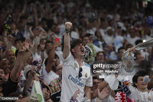 Fans of Real Madrid watch the 2022 UEFA Champions League final match between Liverpool and Real Madrid from a giant screen set up at Santiago...