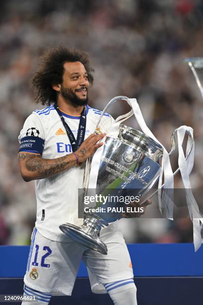 Real Madrid's Brazilian defender Marcelo celebrates with The Champions League trophy after Madrid 's victory in the UEFA Champions League final...