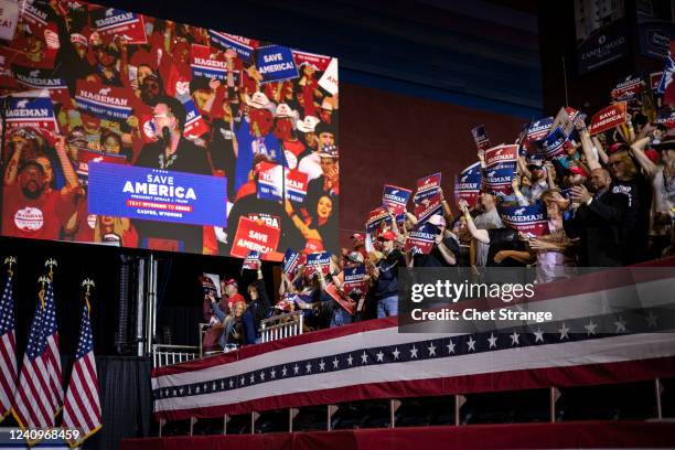 Attendees cheer as Wyoming candidate for Governor Harriet Hageman walks on stage to introduce former President Donald Trump at a rally on May 28,...