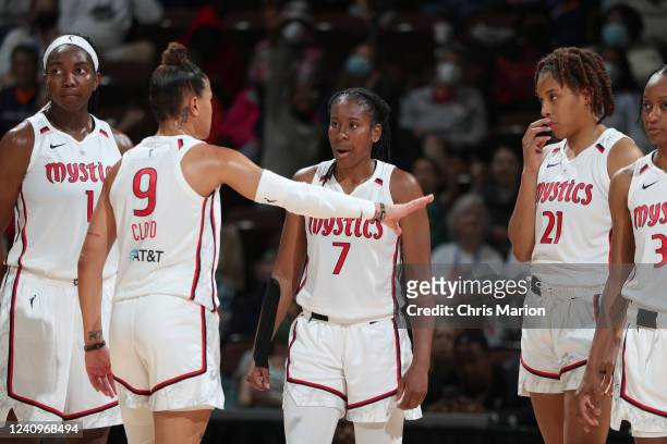 Ariel Atkins talks to Natasha Cloud of the Washington Mystics during the game against the Connecticut Sun on May 28, 2022 at the Mohegan Sun Arena in...