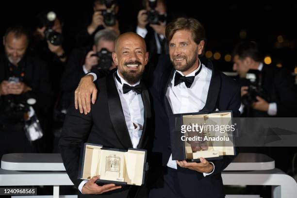 Ruben Ostlund with the Palme D'or Award for "Triangle of Sadness" and Tarik Saleh with the Best Screenplay Award for "Boy from Heaven" pose for a...