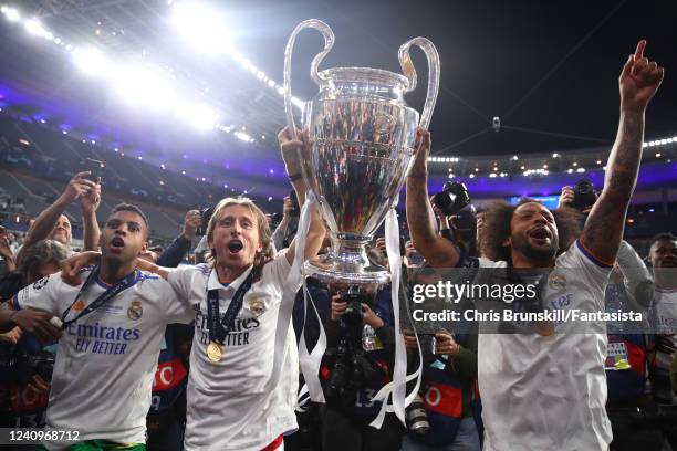 Luka Modric of Real Madrid celebrates with Marcelo and the trophy at the end of the UEFA Champions League final match between Liverpool FC and Real...