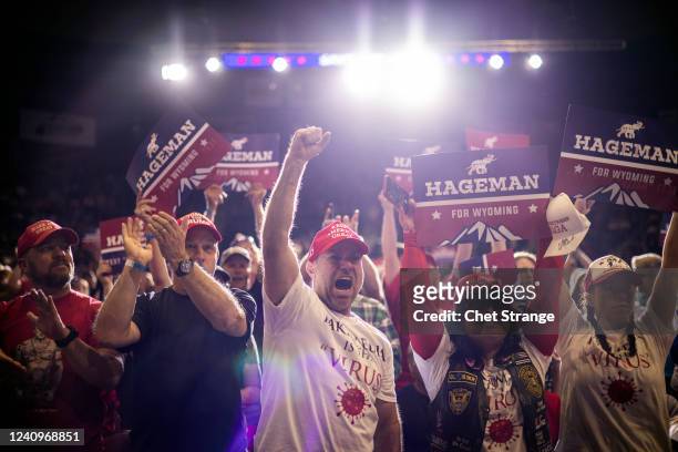 Attendees cheer as former President Donald Trump speaks at a rally on May 28, 2022 in Casper, Wyoming. The rally is being held to support Harriet...
