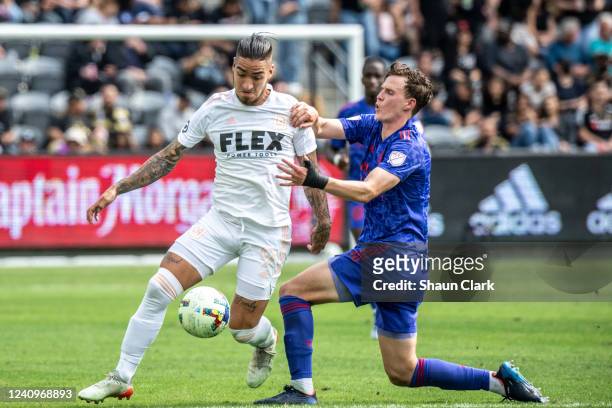 Cristian Arango of Los Angeles FC battles Tanner Beason of San Jose Earthquakes during the match at Banc of California Stadium in Los Angeles,...