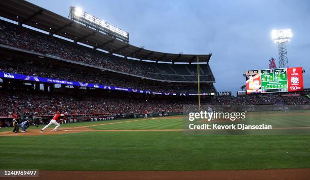 Shohei Ohtani of the Los Angeles Angels hits a ground out against starting pitcher Yusei Kikuchi of the Toronto Blue Jays during the first inning at...