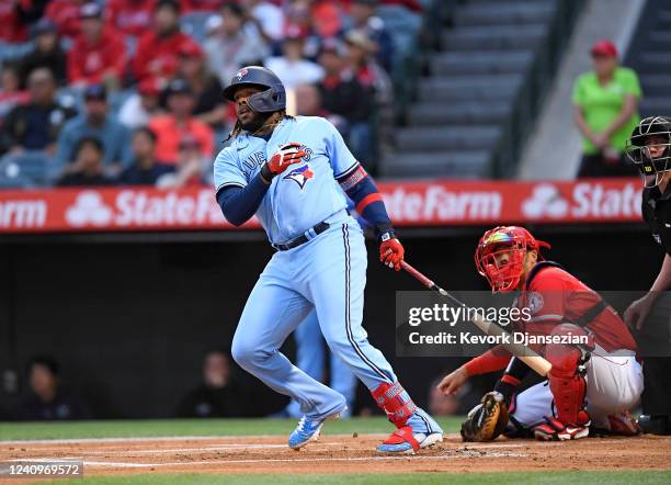 Vladimir Guerrero Jr. #27 of the Toronto Blue Jays hits a double against starting pitcher Michael Lorenzen of the Los Angeles Angels during the first...