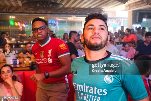 Fans of Liverpool and Real Madrid watch the UEFA Champions League final in Barranquilla, Colombia on May 28, 2022. In Barranquilla, Colombia there...