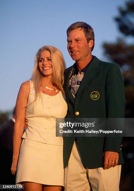 Ben Crenshaw of the United States poses in the green jacket alongside his wife Julie after winning the US Masters Golf Tournament at the Augusta...