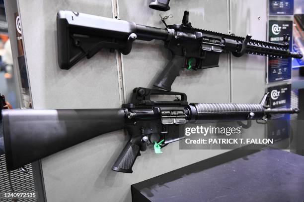 Colt M4 Carbine and AR-15 style rifles are displayed during the National Rifle Association Annual Meeting at the George R. Brown Convention Center,...